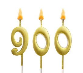Golden birthday candle isolated on white background, number 900	