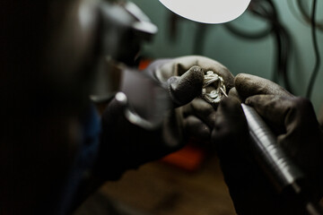 close-up. The jeweler makes a silver ring. On the island of Bali. Indonesia