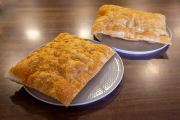 Chebureki or fried pie with meat on plate close up