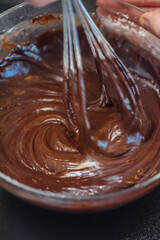 Chocolate Dessert dough cooking in glass bowl. Home cooking