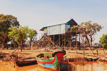Tonle Sap lake. Kampong Phluk floating fishing village during drought season. Houses on stilts,...