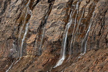 Fototapeta na wymiar Water falls on Mount Edith Cavell