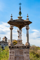 Fototapeta premium It's Statue on the Royal Bridge of Valencia, Spain