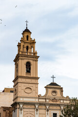 Fototapeta na wymiar It's Saint Monica church and the Serrano bridge, Valencia, Spain
