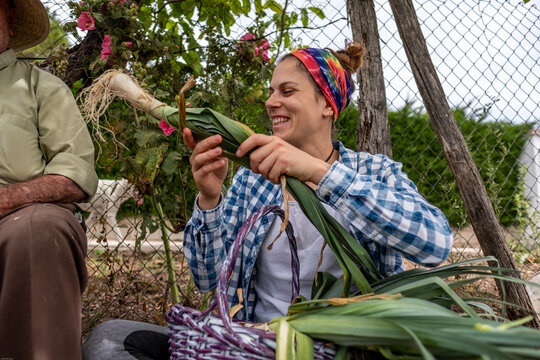 Young woman catching leeks