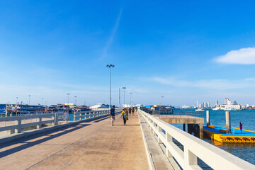 Tourists walk up from Bali Hai Pier