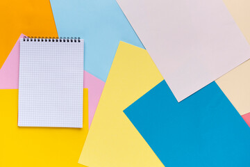Many colorful empty notepad sheets of paper, flat lay view.