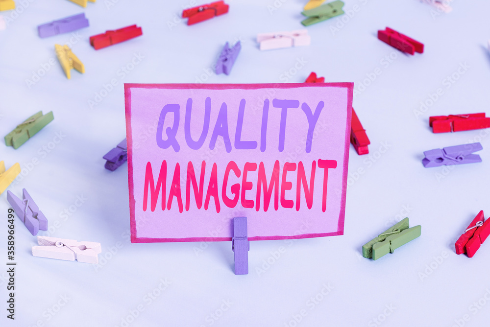 Aufkleber writing note showing quality management. business concept for act of overseeing activities that must