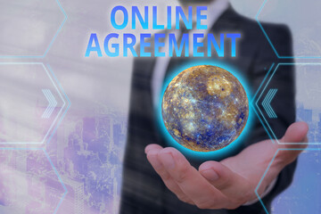Handwriting text Online Agreement. Conceptual photo contracts that are created and signed over the...