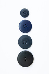 black buttons for clothes on a white background