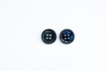 black buttons for clothes on a white background