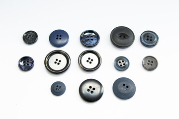 black buttons for clothes on a white background