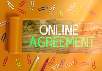 Conceptual hand writing showing Online Agreement. Concept meaning contracts that are created and...