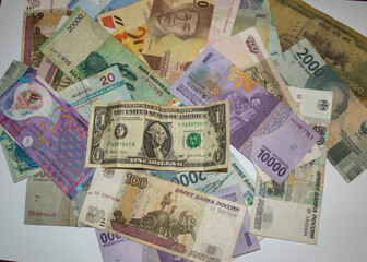 Fototapeta na wymiar Closeup shot of different currencies. Good for presentations in finance, accounting or business development 