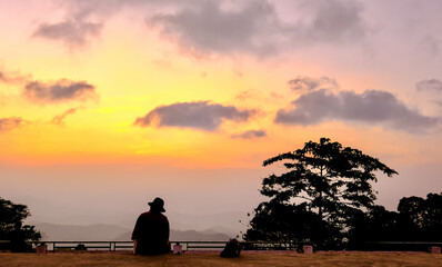 Obraz na płótnie Canvas silhouette of a man and at sunset