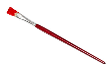 flat paint brush with red colored tip and brown handle isolated on white background