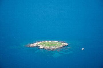 Small, lonely uninhabited island, in the midst of the endless sea