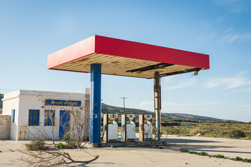 Abandoned gas station in the middle of nowhere. Old  gas pumps