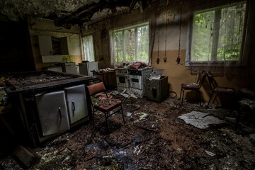 Kitchen in an abandoned holiday center in the middle of the forest