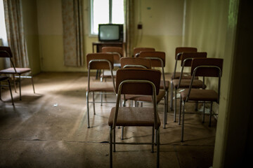 A TV room in an abandoned resort in the middle of the forest