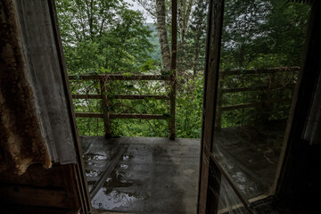 The interior of the buildings in an abandoned resort located in the middle of the forest