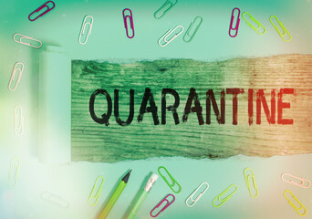 Conceptual hand writing showing Quarantine. Concept meaning restraint upon the activities of an...