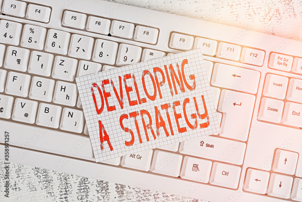 Poster writing note showing developing a strategy. business concept for discussing the ideas for new goal m