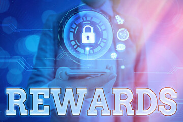Text sign showing Rewards. Business photo showcasing certain number or percentage you earn for...