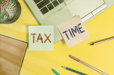 Writing note showing Tax Time. Business concept for Notification of the need to file tax returns...