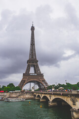 Fototapeta na wymiar The eiffel tower on a cloudy day, in Paris, France.