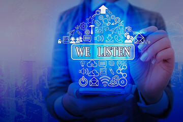 Word writing text We Listen. Business photo showcasing an organization willing to pay attention by...
