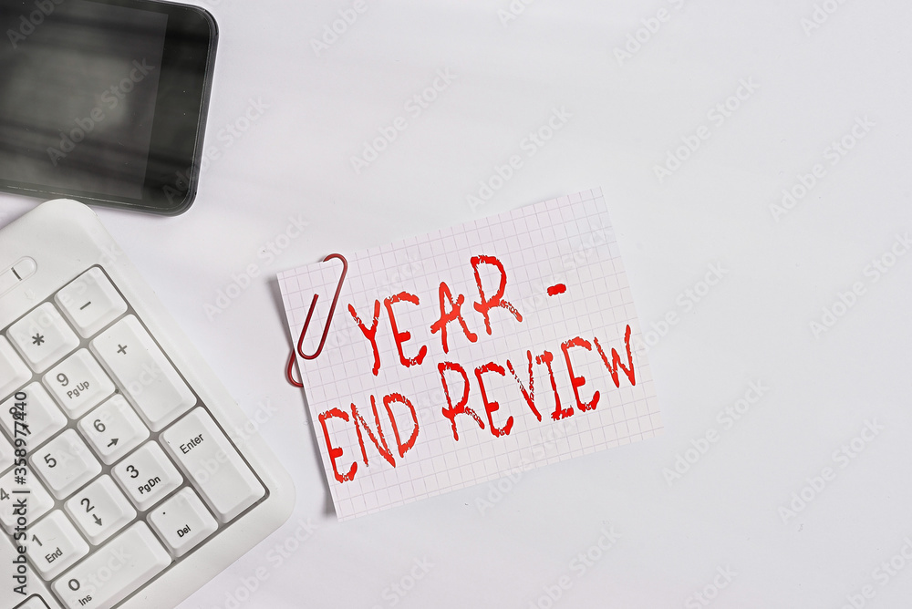 Poster handwriting text year end review. conceptual photo annual assessment of achievement and goal develop