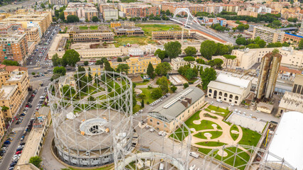 Obraz na płótnie Canvas Aerial view of the Gasometer in the Ostiense district in Rome. The industrial center has been in disuse and abandoned for some time.