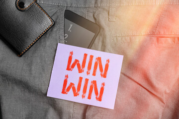 Writing note showing Win Win. Business concept for balanced situation resulting into advantages and...