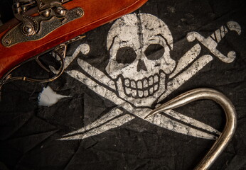 black pirate flag jolly roger pistol and steel sharp hook