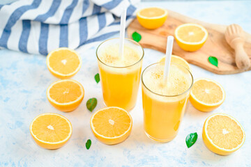 orange juice in a glass, top view, slices of oranges, straw, healthy lifestyle concept