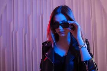 Beautiful girl dancing in retro wave on the neon light