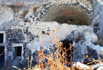 Old derelict cave houses in the village of  Vothanos in central Santorini, Greece.