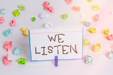Word writing text We Listen. Business photo showcasing an organization willing to pay attention by...