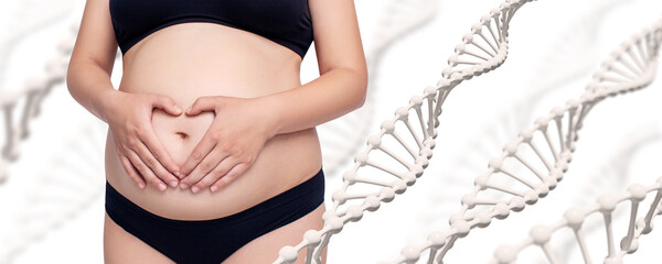 Pregnant woman with heart shape hands on belly among DNA stems.