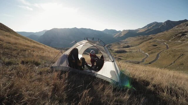 People inside the tent. on a mountainside in Montenegro mooving camera