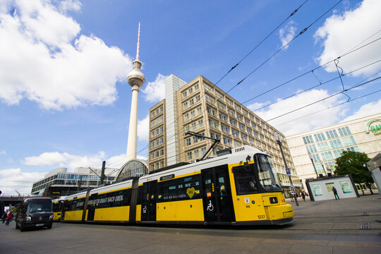 Berlin, Germany - May 29, 2019: View of the Alexanderplatz station in Berlin, Germany, with the structure of the Berliner Fernsehturm, the popular television tower, in the background