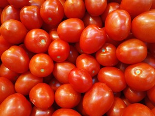 a lot of grape tomatoes for sale at farmer market
