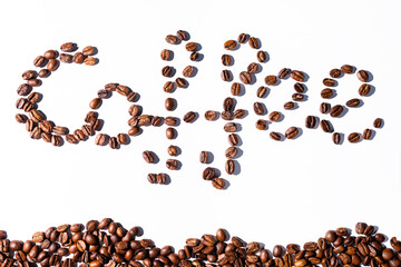 coffee beans on a white background, coffee text. concept of making coffee at home and coffee shops. background.