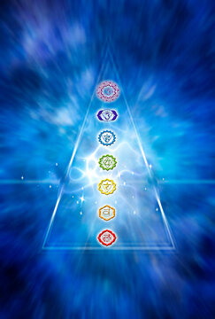 abstract blue background with seven chakras chakra in mystic spiritual triangel with lights and rays effect like esoteric mystical nad reiki concept 