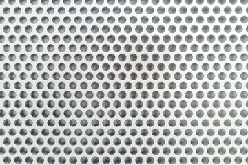 Close up round patterned on metal wall for background.