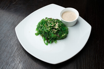 Chuka seaweed with sauce on white plate