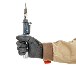 Contemporary gas soldering iron in electrician fist in black protective glove and brown uniform isolated on white background
