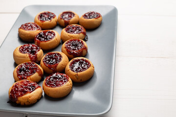 Sweet berry jelly cookies on grey plate.