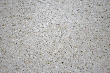 Light beige granite background texture.